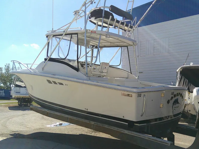 Slide: The Image of 2000 Luhrs Tournament 290 Open boat on display, featuring a sleek white design. - 15