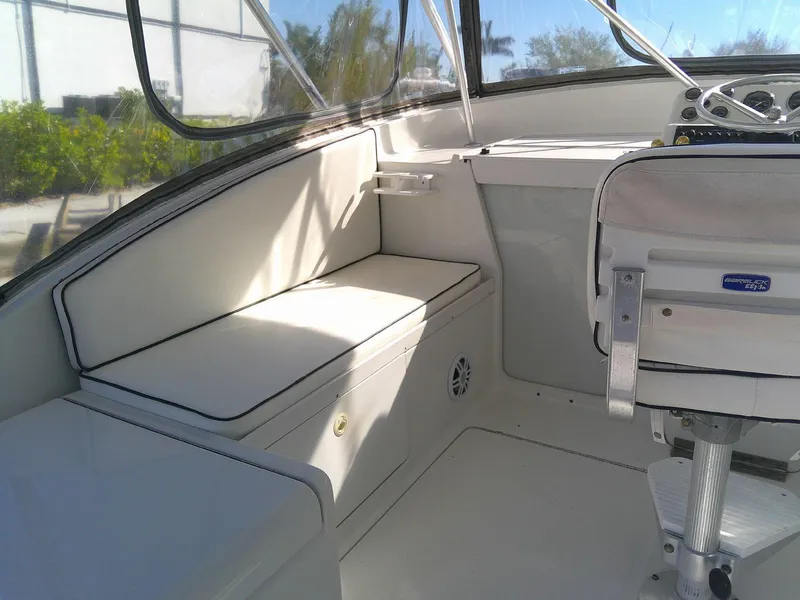 Slide: The Image of 2000 Luhrs Tournament 290 Open boat interior with seating and helm. - 17