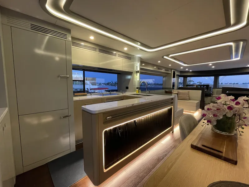 Slide: The Image of Luxurious interior of 2023 Sirena 68 yacht, featuring modern kitchen and elegant lighting. - 10