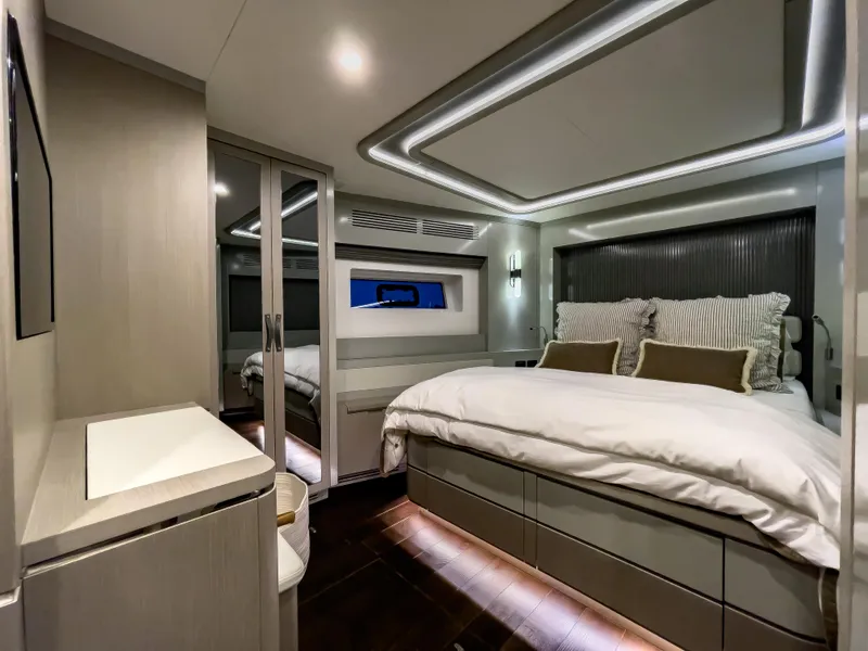 Slide: The Image of Luxurious bedroom interior of 2023 Sirena 68 yacht with modern design and ambient lighting. - 14