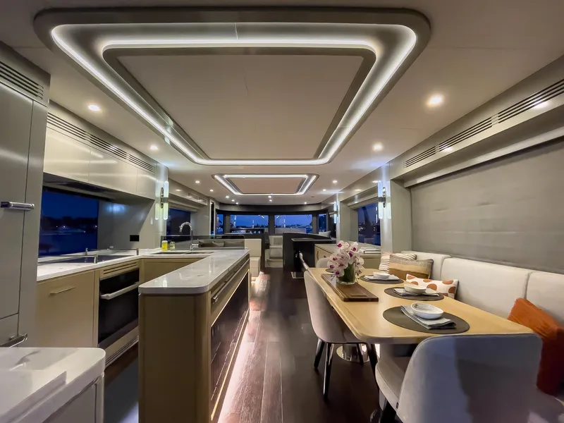 Slide: The Image of Luxurious interior of 2023 Sirena 68 yacht with modern dining and kitchen area. - 15