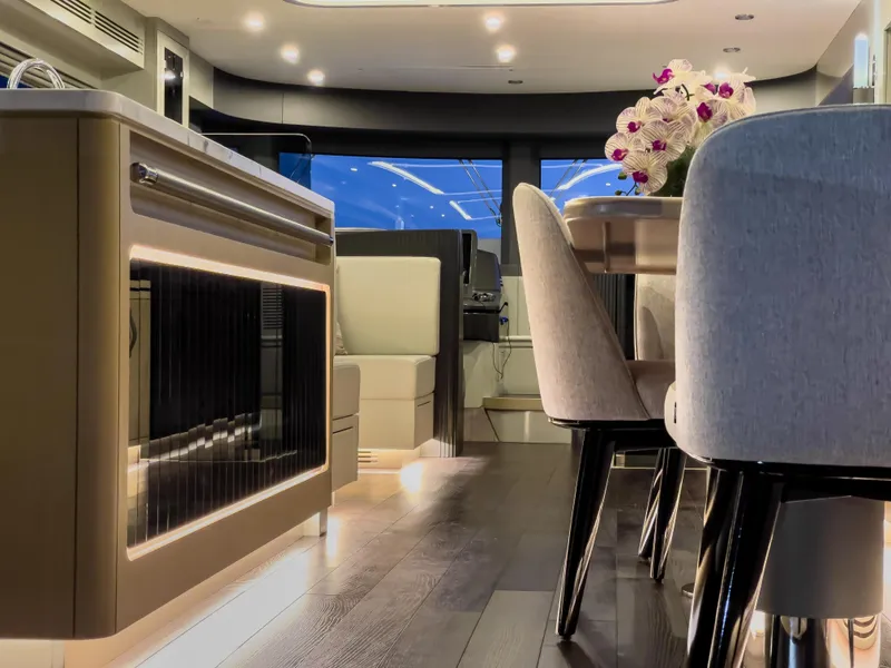 Slide: The Image of Luxurious interior of 2023 Sirena 68 yacht with modern dining area and elegant decor. - 16