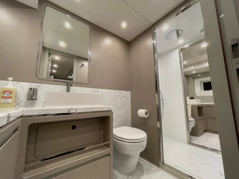 Slide: The Image of Modern bathroom interior on 2023 Sirena 68 yacht, featuring sleek design and elegant fixtures. - 21