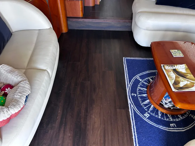 Slide: The Image of Interior of 2006 Viking Princess 61 Flybridge with leather seating and nautical-themed decor. - 16