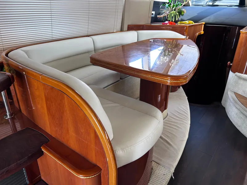 Slide: The Image of Luxurious interior of 2006 Viking Princess 61 Flybridge yacht with elegant wood and leather seating. - 17