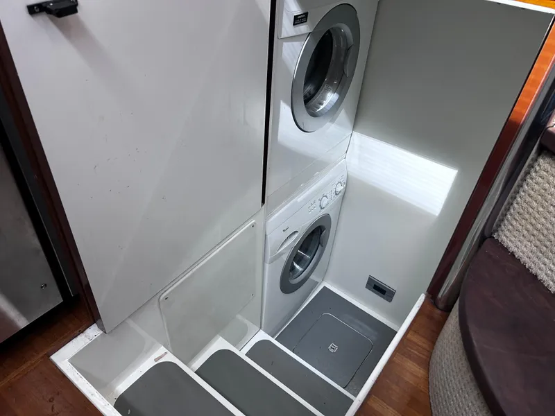 Slide: The Image of Stacked washer and dryer in 2006 Viking Princess 61 Flybridge yacht. - 20