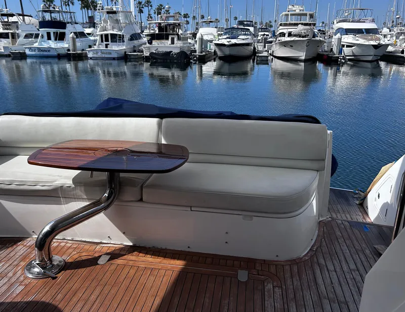 Slide: The Image of Luxury yacht Viking Princess 61 Flybridge 2006, docked with elegant seating and marina view. - 8