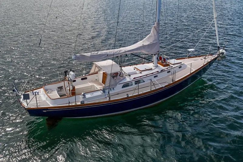 Slide: The Image of Hinckley Sou'wester 42 Sloop, 1994 model, sailing on calm waters. - 1