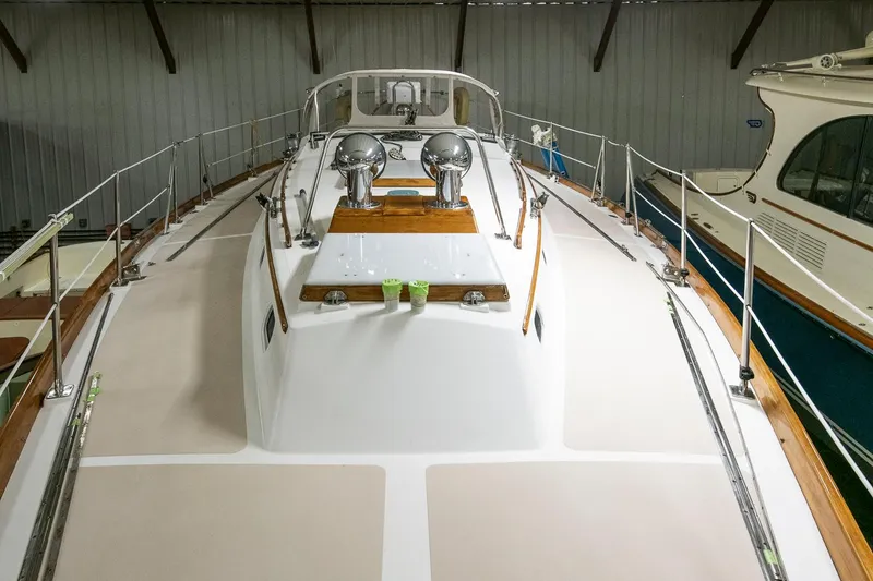 Slide: The Image of Hinckley Sou'wester 42 Sloop, 1994 model, docked indoors, showcasing deck and rigging. - 14