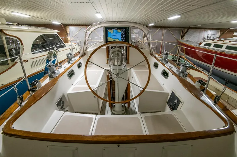 Slide: The Image of Cockpit of 1994 Hinckley Sou'wester 42 Sloop with wooden wheel and navigation equipment. - 19