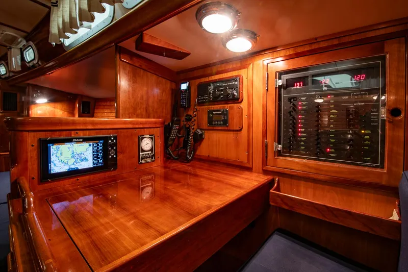 Slide: The Image of Navigation station of 1994 Hinckley Sou'wester 42 Sloop with control panels and equipment. - 27