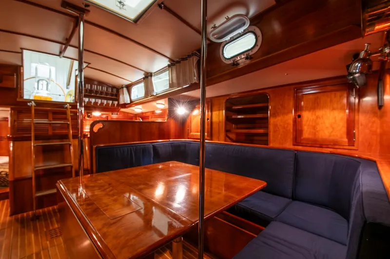 Slide: The Image of Interior of 1994 Hinckley Sou'wester 42 Sloop with wooden finishes and blue seating. - 35