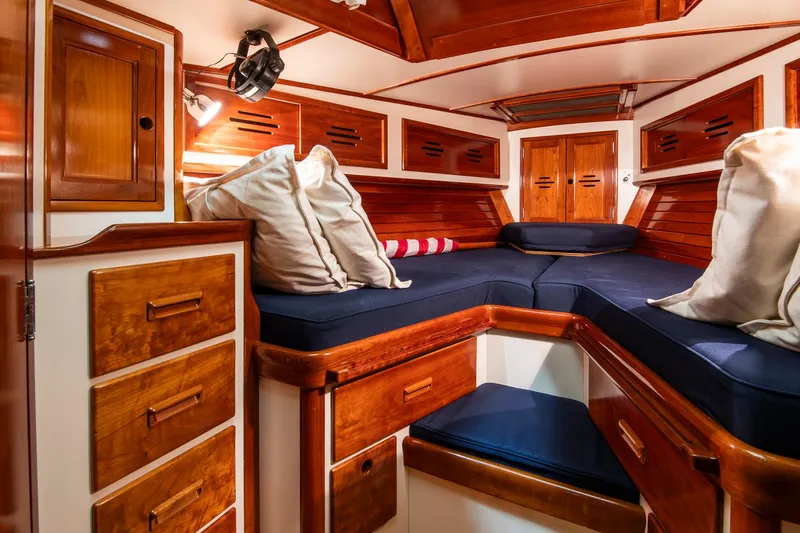Slide: The Image of Luxurious cabin interior of 1994 Hinckley Sou'wester 42 Sloop with wooden finish and cozy seating. - 36