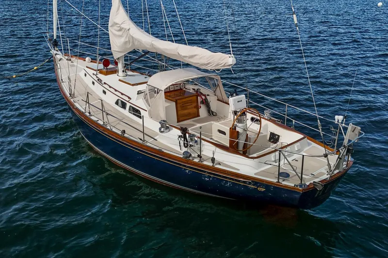 Slide: The Image of 1994 Hinckley Sou'wester 42 Sloop sailing on calm blue waters. - 5