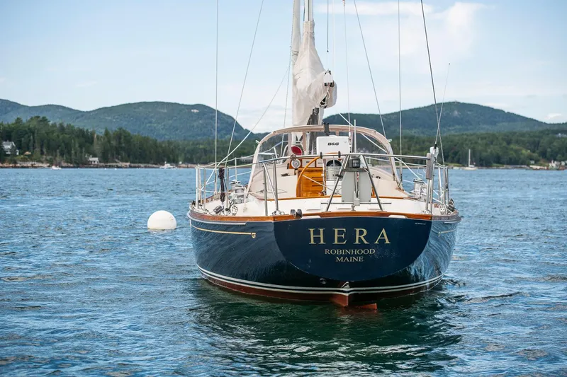 Slide: The Image of Hinckley Sou'wester 42 Sloop, 1994, named "Hera," anchored in scenic waters. - 10