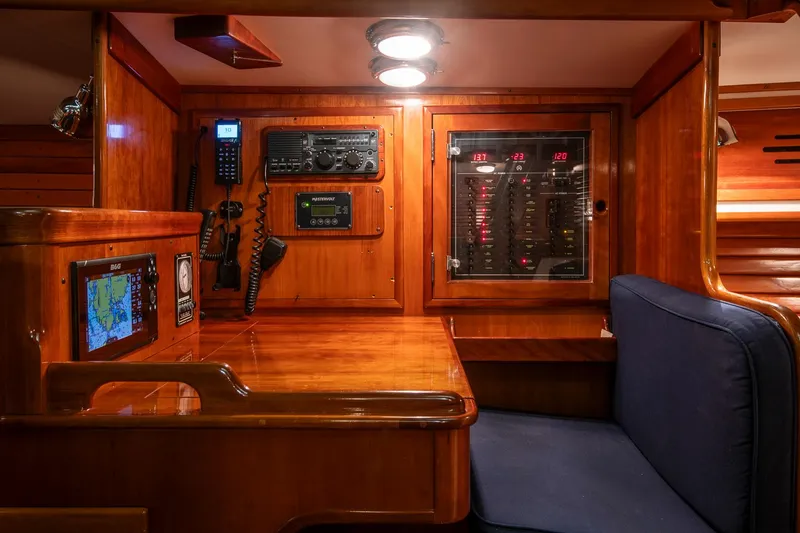 Slide: The Image of Hinckley Sou'wester 42 Sloop 1994 interior with navigation equipment and wooden finish. - 26