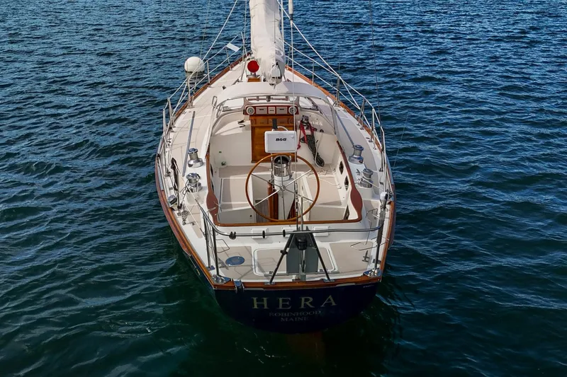 Slide: The Image of 1994 Hinckley Sou'wester 42 Sloop, named "HERA," sailing on open water. - 4