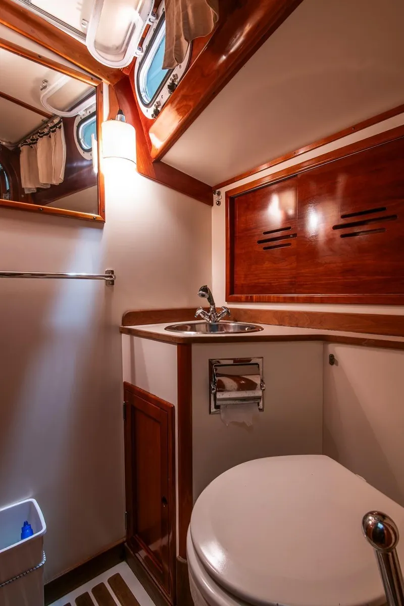 Slide: The Image of Luxurious 1994 Hinckley Sou'wester 42 Sloop bathroom with wood accents and modern fixtures. - 44