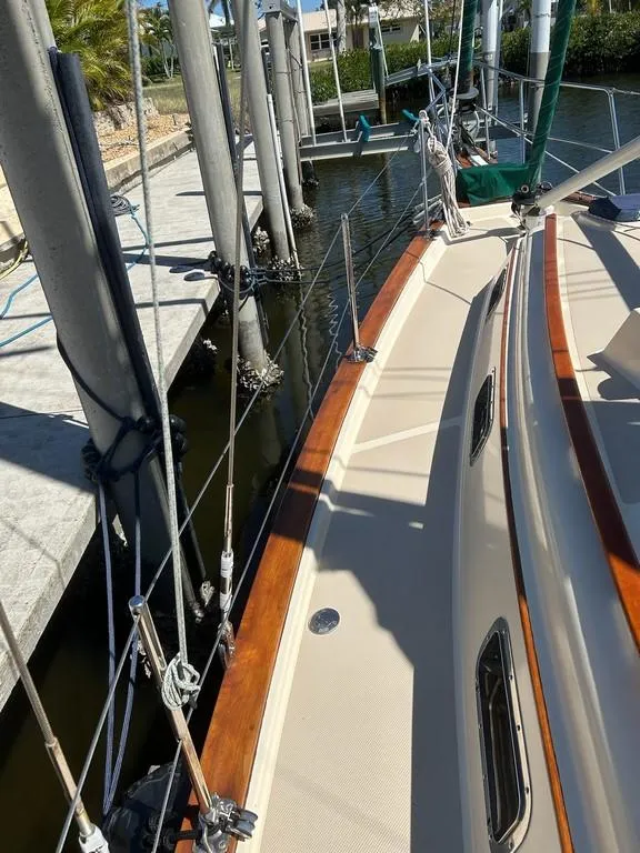 Slide: The Image of 1998 Island Packet 40 sailboat docked, showcasing deck and rigging details. - 14