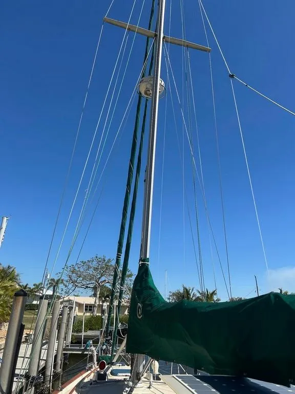 Slide: The Image of 1998 Island Packet 40 sailboat mast and rigging against clear blue sky. - 22