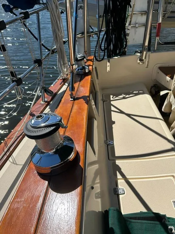 Slide: The Image of 1998 Island Packet 40 sailboat deck with winch and teak accents. - 26