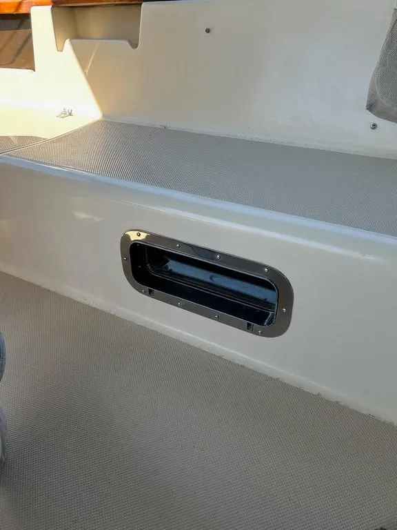Slide: The Image of 1998 Island Packet 40 boat interior detail with vent on beige surface. - 27