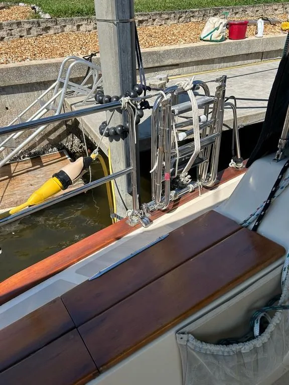 Slide: The Image of Island Packet 40 sailboat deck, 1998 model, docked with visible rigging and equipment. - 42