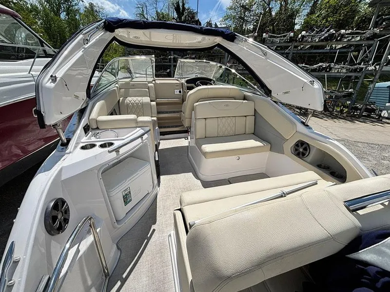 Slide: The Image of 2020 Regal 28 Express boat interior with beige seating and open cockpit. - 11