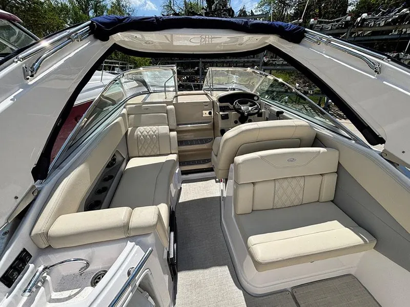 Slide: The Image of 2020 Regal 28 Express boat interior with beige seating and modern design. - 12