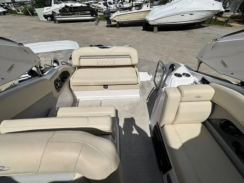 Slide: The Image of 2020 Regal 28 Express boat interior with beige seating and open deck layout. - 13