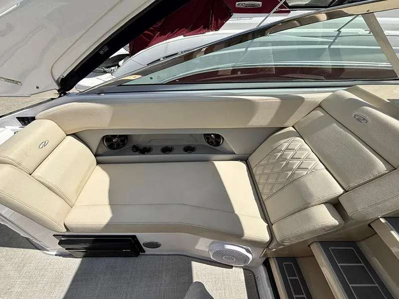 Slide: The Image of 2020 Regal 28 Express boat interior with beige leather seating and modern design. - 4