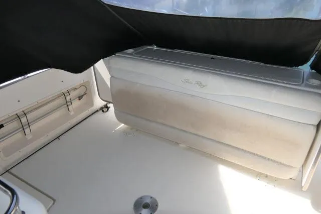 Slide: The Image of 2005 Sea Ray 340 Sundancer boat interior with seating and covered area. - 26