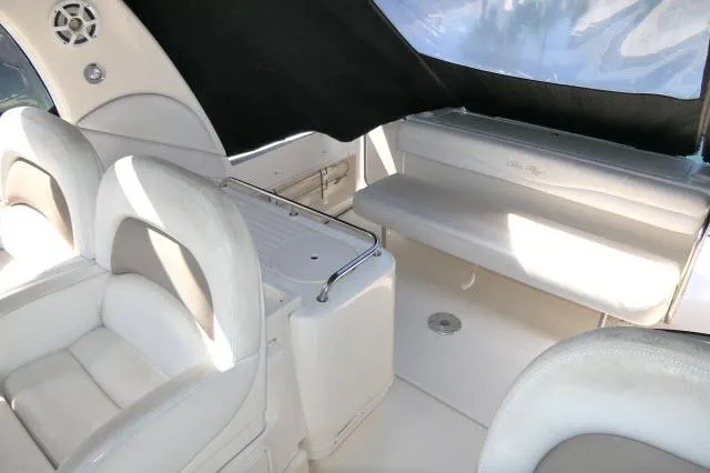 Slide: The Image of 2005 Sea Ray 340 Sundancer interior with white seating and sleek design. - 27