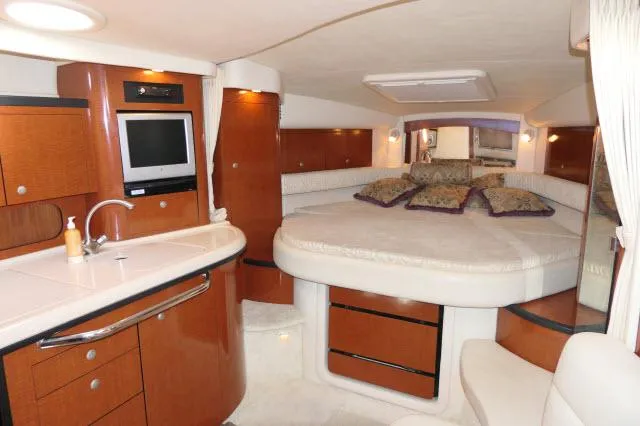 Slide: The Image of Luxurious interior of 2005 Sea Ray 340 Sundancer with cozy bed and modern amenities. - 3
