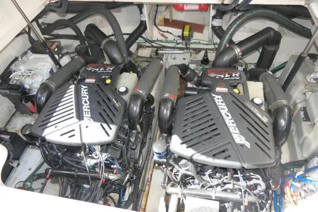 Slide: The Image of Twin Mercury engines in a 2005 Sea Ray 340 Sundancer boat engine compartment. - 37