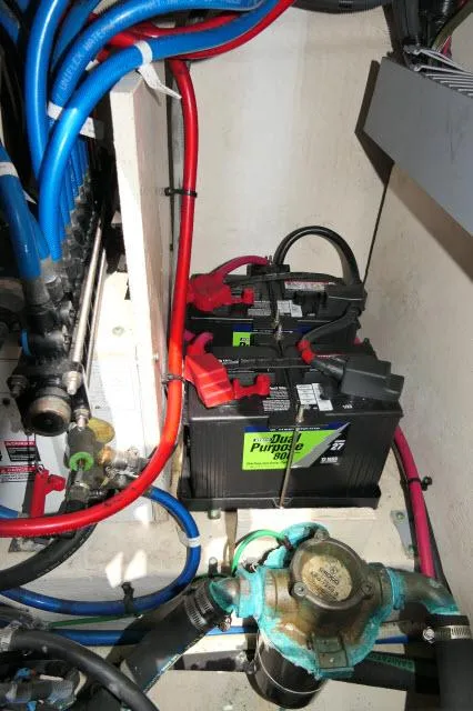 Slide: The Image of Engine compartment of a 2005 Sea Ray 340 Sundancer with batteries and wiring. - 39