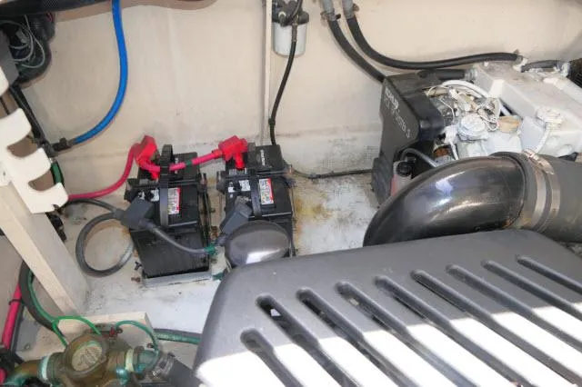 Slide: The Image of Engine compartment of 2005 Sea Ray 340 Sundancer with batteries and wiring. - 40