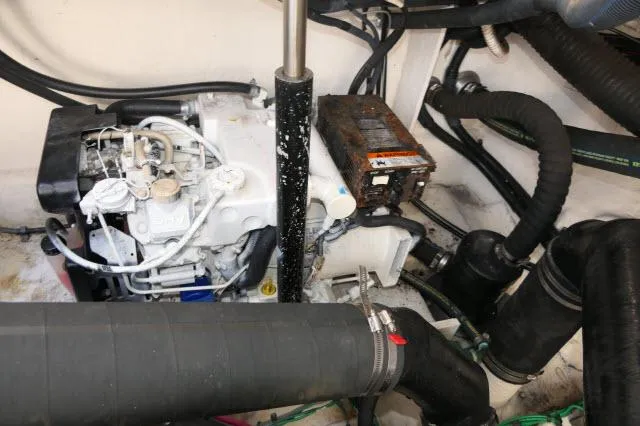 Slide: The Image of Engine compartment of 2005 Sea Ray 340 Sundancer with visible components and wiring. - 44
