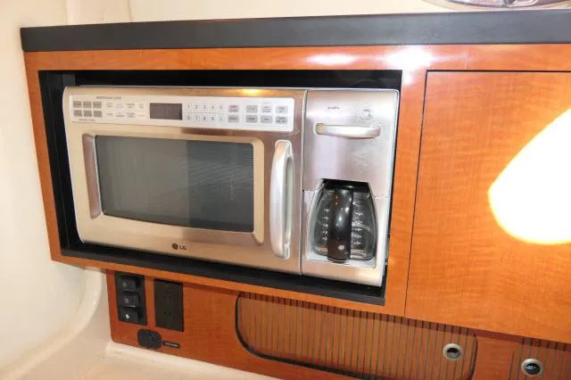 Slide: The Image of Built-in microwave and coffee maker in 2005 Sea Ray 340 Sundancer yacht kitchen. - 5