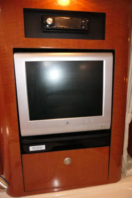 Slide: The Image of Entertainment system in 2005 Sea Ray 340 Sundancer yacht interior. - 7