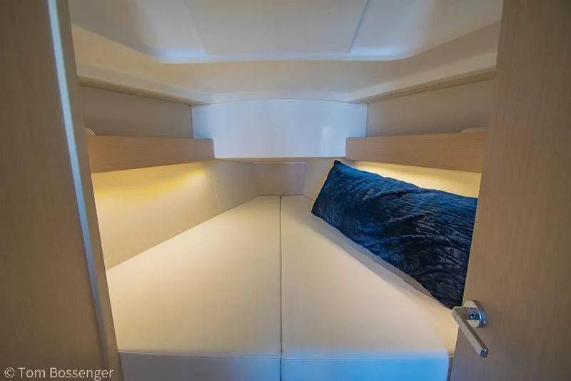 Slide: The Image of Cozy cabin interior of 2022 Beneteau Oceanis 30.1 sailboat with modern design. - 18