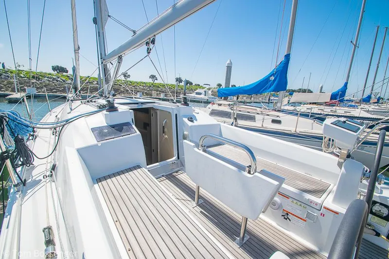 Slide: The Image of Beneteau Oceanis 30.1 sailboat cockpit, 2022 model, docked in a sunny marina. - 25