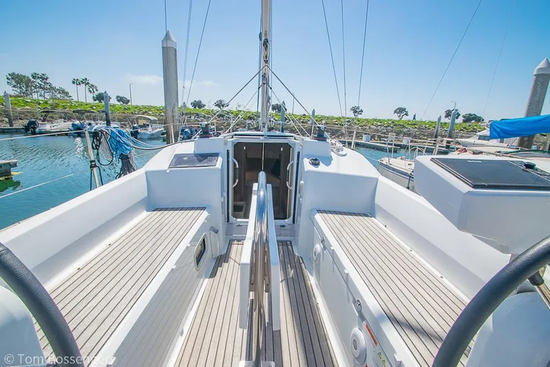 Slide: The Image of Beneteau Oceanis 30.1 sailboat cockpit, 2022 model, docked in a sunny marina. - 27
