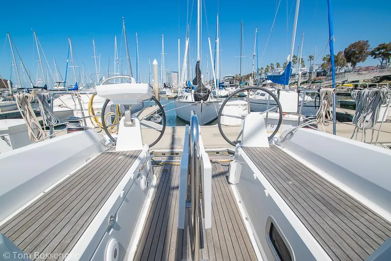 Slide: The Image of Beneteau Oceanis 30.1 sailboat, 2022 model, docked in a marina with clear blue skies. - 28