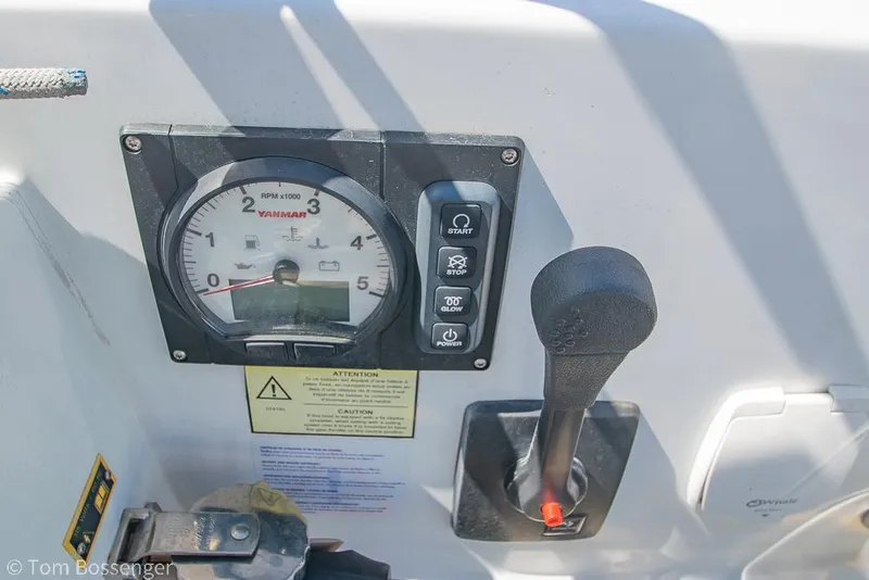 Slide: The Image of Control panel of a 2022 Beneteau Oceanis 30.1 sailboat with throttle and gauge. - 32