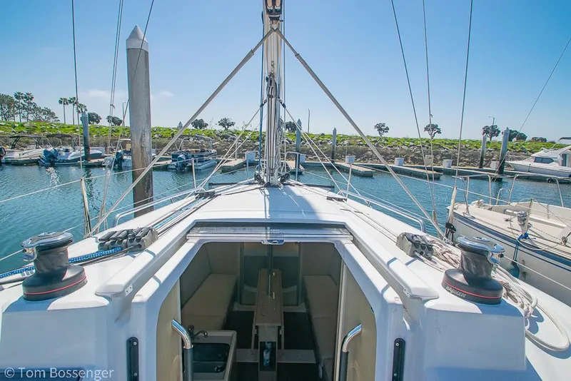 Slide: The Image of Beneteau Oceanis 30.1 sailboat, 2022 model, docked in a sunny marina. - 34