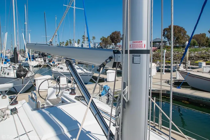 Slide: The Image of Beneteau Oceanis 30.1 sailboat, 2022 model, docked in a marina under clear blue skies. - 36