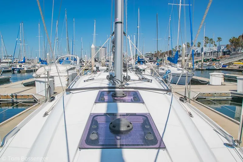 Slide: The Image of Beneteau Oceanis 30.1 sailboat docked in a marina, 2022 model, sunny day. - 39