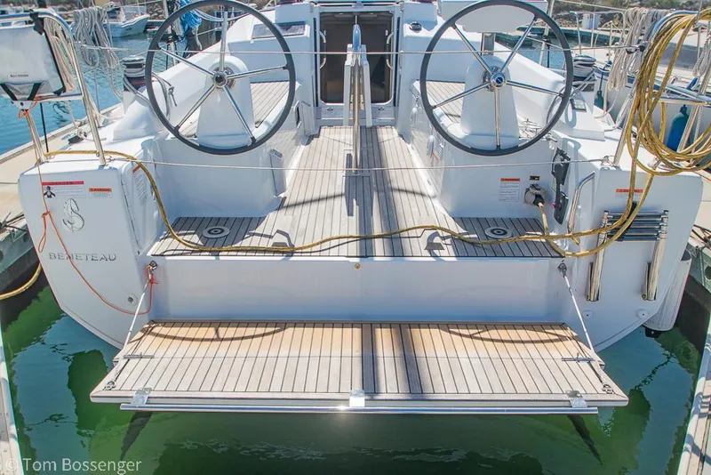 Slide: The Image of Beneteau Oceanis 30.1 yacht, 2022 model, featuring dual steering wheels and spacious deck. - 42