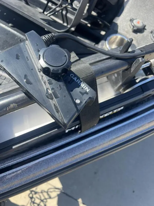 Slide: The Image of Garmin device mounted on a 2015 Triton 20TRX boat, wet with water droplets. - 10